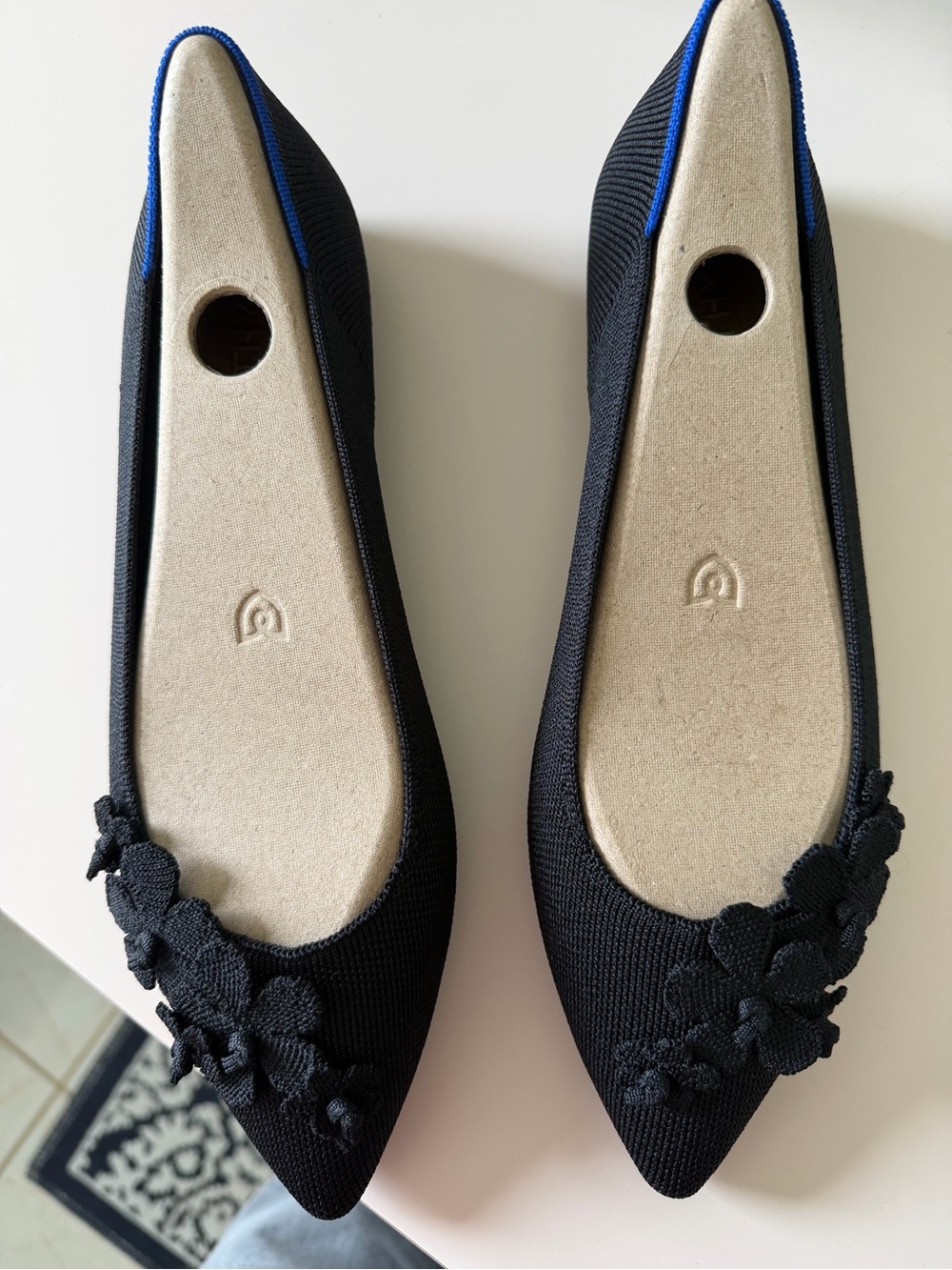 Rothy's Black Pointed Toe Floral Knit Flats with Blue Trim